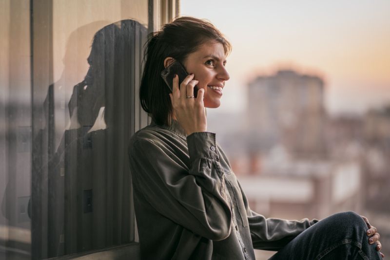 Woman on a phone call from her apartment
